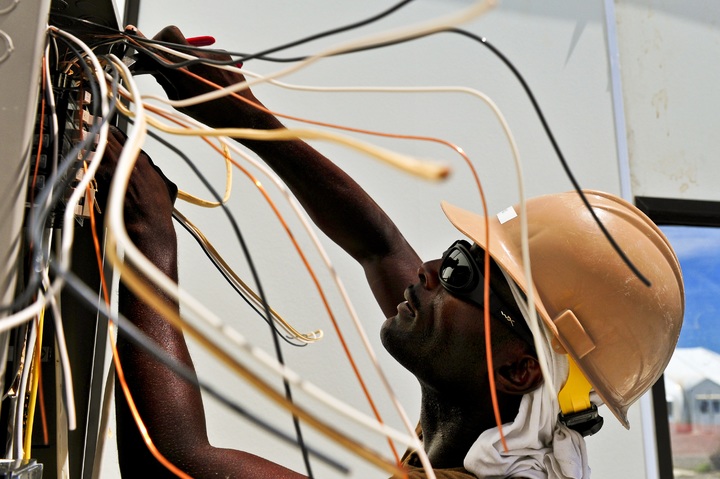 Electrician fixing a circuit box