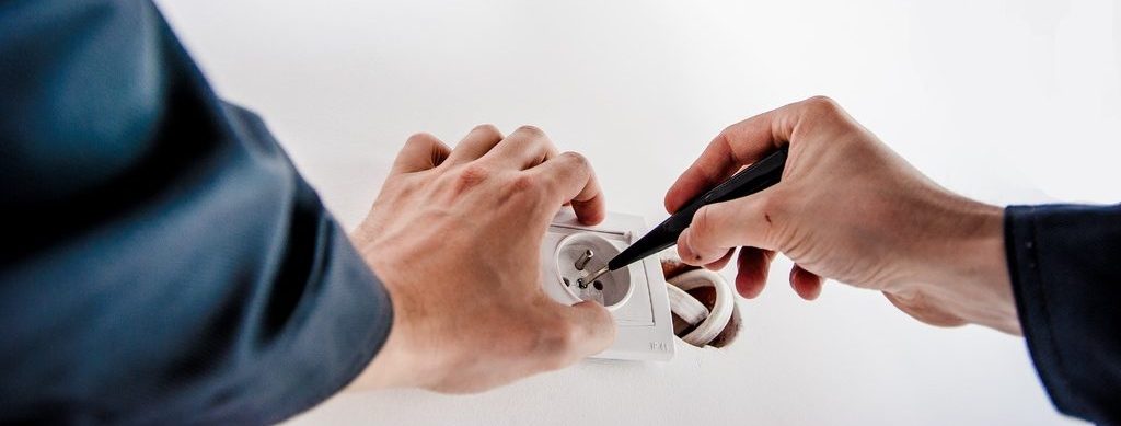Electrician fixing a socket